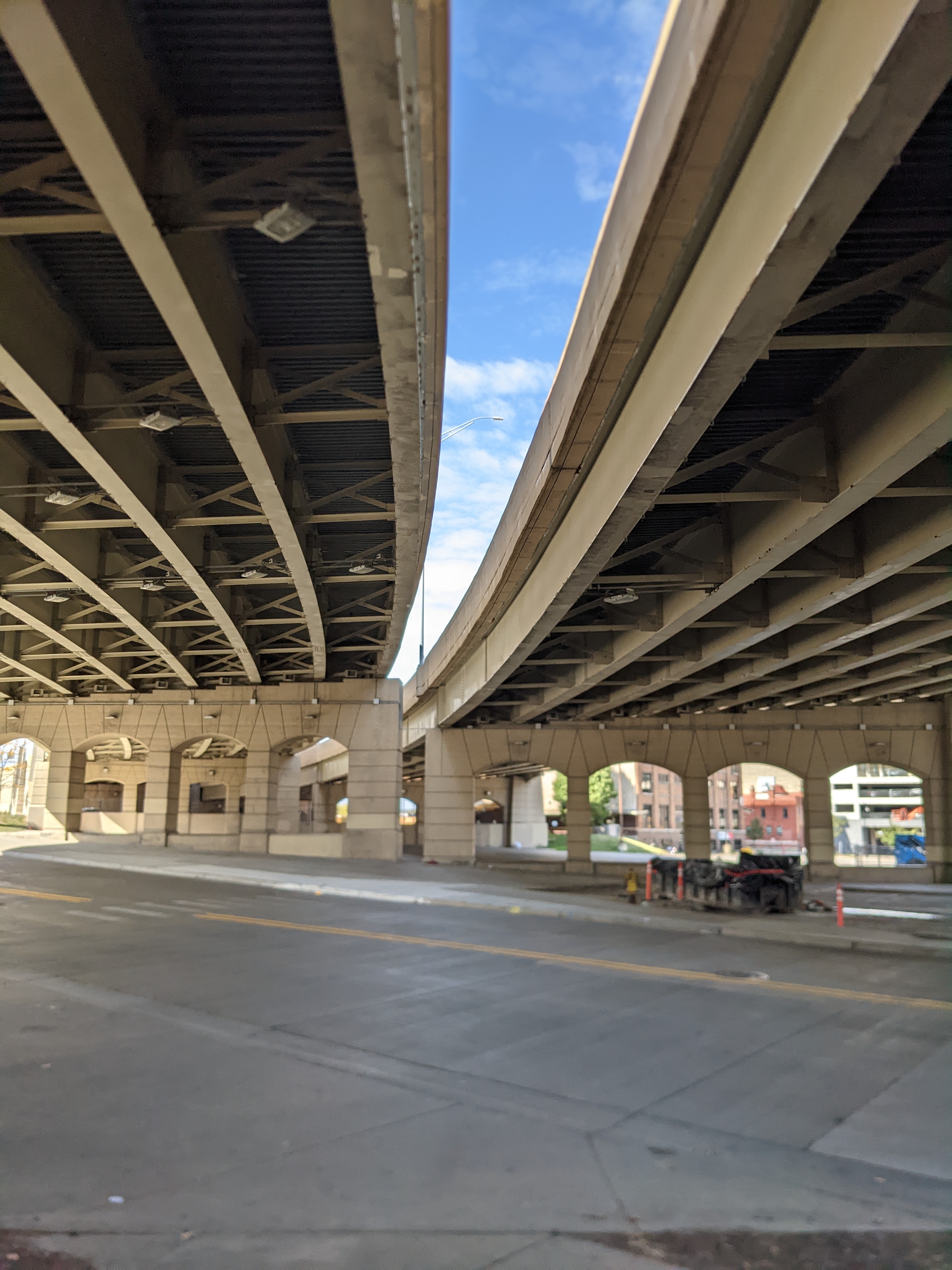 A brilliant blue sky between two bridges